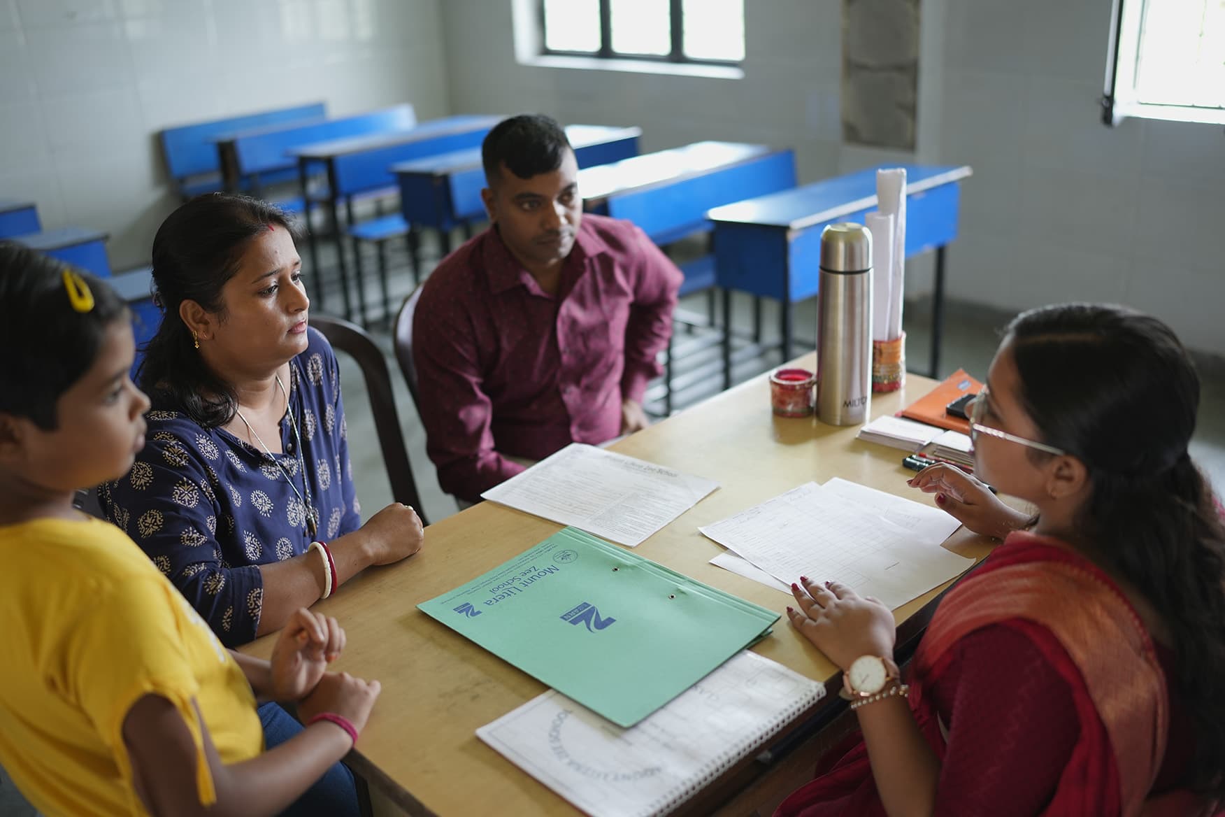 Coach encouraging students during drills